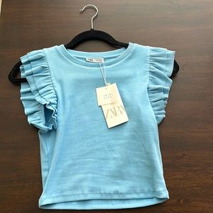 Baby blue top from Zara. Size M